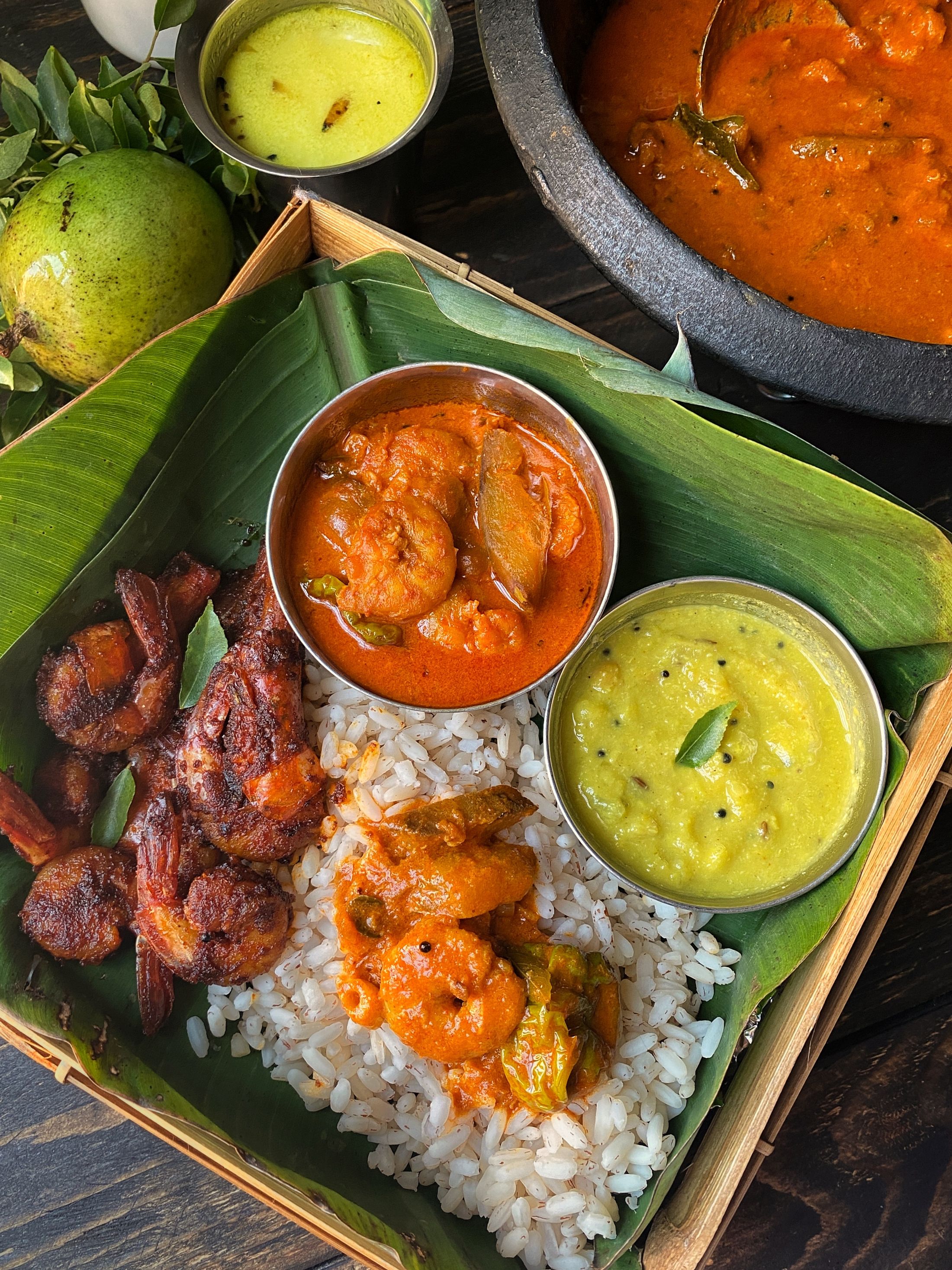 Traditional coastal meal presented on a banana leaf